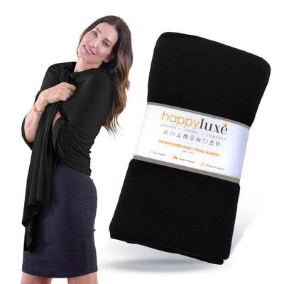 The Wayfarer travel wrap in classic jet black is a fashionable and versatile wrap and travel blanket, also can be used as a scarf, cover-up, pashmina, and so much more.  This wrap is made from luxurious eco-friendly Tencel fiber material, a plant-based textile and cellulose fiber that is made from sustainably harvested beech trees, is absorbent and breathable, and is resistant to fading, pilling, and wear.  This amazing fabric is machine washable. 68 x 35 inches.  Made in the U.S.A.