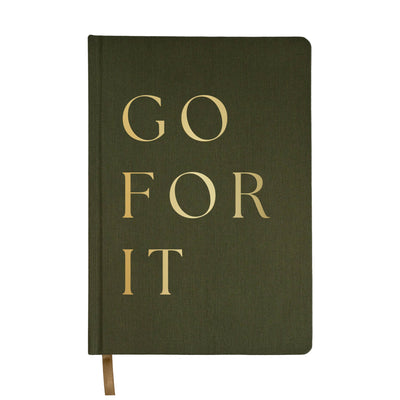 Our Go For It olive green and gold fabric journal is a chic, stylish, and easy to write on notebook. There's no better place to jot down motivational notes, goals, inspirational quotes, lists, and great ideas.  DETAILS:  Size: 8.1 x 5.6 x 0.6” Design: Go For It Olive Fabric Journal with Gold Foil Details 100gsm Uncoated Lined Paper Ribbon Bookmark in Gold 100 Pages Front and Back (200 Total) Designed in the USA