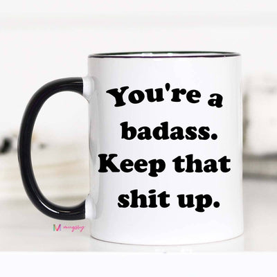 You're a Badass Keep That Shit Up Mug: 11oz.  
Double sided print. Top rack dishwasher safe. Microwave safe.

Off white with a black rim and handle. Made of ceramic.