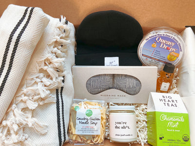 This encouraging gift set includes all the comfy necessities they need.  A care package  that includes both comfortable and practical items that are very helpful for those going through a difficult season of life.  The large Turkish blanket, black beanie and therapeutic eye mask are all items that will bring warmth and coziness to the gift receiver.  The soup, tea, queasy drops and honey are all individual sized items that they can prepare. "you're the sh*t" candle.