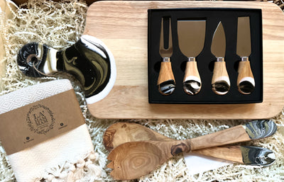 Surprise a special someone with this premium Entertainer's Delight Gift Set! This complete set is perfect for elevating any home entertaining event. The modern resin art cutting board epitomizes superior craftsmanship and style, while the included four-piece cheese knife set and set of wooden serving spoons provide the perfect tools for presenting delicious cheeses, appetizers and desserts. And to polish off the perfect hosting moment, a unique Turkish tea towel 