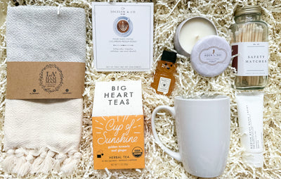 Introducing the perfect gift for any coffee or tea lover - our Refresh and Recharge Coffee and Tea Gift Set! This gift package includes everything needed to enjoy a relaxing cup of coffee or tea, including a beautiful tea towel, pour over coffee, a stylish mug, a cup of sunshine tea, mini honey, a travel soy candle, stylish safety matches, and a nourishing radish root hand cream.