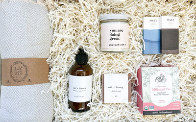 This gift set is the perfect way to show your love and appreciation for a new mom.  The 'you are doing great' soy candle is non toxic and creates a natural aromatherapy experience.  The 100% cotton throw blanket is soft and cozy, making it perfect for cuddling up with baby.  The oat and honey olive soap and body lotion will nourish her skin with natural ingredients.  She will also enjoy a sweet treat with the organic chocolate minis and calming milkmaid tea to support milk production. 