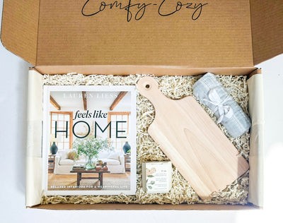 Discover the essence of comfort and tranquility with our Nestled Home Essentials Gift Box curated to bring warmth and serenity to any living space. This thoughtfully crafted gift box includes a copy of 'Feels Like Home: Relaxed Interiors for a Meaningful Life' by renowned designer Lauren Liess, inviting you to embrace the emotional connection between your living environment and your well-being.