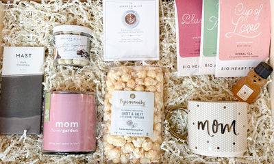  Mom’s Cozy Treats gift bundle!   Our organic dark chocolate is the perfect indulgence, while our 'mom' zinnia flower garden in a glass container will brighten up any room. Our sweet & salty artisanal popcorn is the perfect snack for movie night, and our 'mom' mug is the perfect way to enjoy a cup of tea or coffee. Our mini honey and three herbal tea sampler flavors (cup of love, royal treatment and blushing) are the perfect accompaniment, while our pour over coffee set of 2 and chocolate espresso beans 