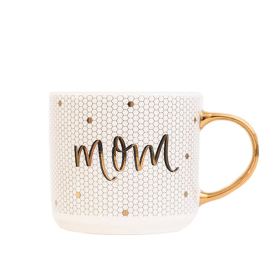 Mom - Gold, White Tile Hand Lettered Coffee Mug - 17 oz  DETAILS:  17oz Fine Bone China Size: 4 x 3.5" (5.5" w/handle) Hand Lettered Design: Mom Design on Both Sides of Mug White and Honeycomb Design with Real Gold Handle Embellishment and Lettering Designed in the USA, Imported