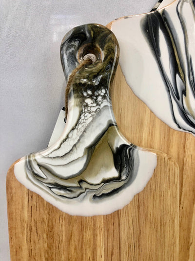 Gorgeous black, white and gold large cheese and charcuterie board (18" x 8").  This beautiful board is functional ResinArt at it's best.  It will surely make a statement in your home. 