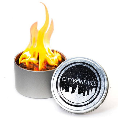 City Bonfires is a portable fire pit, handmade with nontoxic materials in Maryland by 2 Dads.  The portable, compact design makes it easy to take on all your outdoor adventures.  Bring your own bonfire wherever you roam. No wood, no embers, no soot!  Features: A great portable heat source with no smoke and ashes.  Safe to roast marshmallows with FDA food grade soy wax.  Super easy to light and extinguish 3 to 5 hours of burn time  Size: 4 in x 2 in tin  Handmade with ❤️ in Maryland, USA