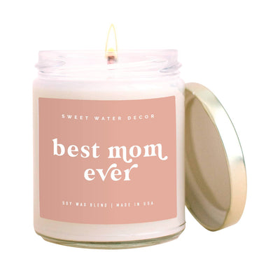 Best Mom Ever! Soy Candle - Clear Jar - Blush Pink - 9 oz  SCENT: Spa Day SCENT NOTES: • Top: Sea Salt, Jasmine • Middle: Wood • Base: Cream  Hand poured in the USA, our Best Mom Ever! clear jar vessel, with its pink label, looks great in any space. Perfect for Mothers Day, Birthday Gifts for Mom, Spring, Home Decor + More! 