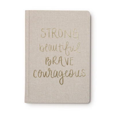 Write down all of your goals and dreams in this hand lettered Strong Beautiful Brave Courageous, Tan and Gold Fabric Journal! With this chic, easy to write on notebook, there's no better place to jot down motivational notes, inspirational quotes, lists, and all of your great ideas! Perfect for work or school.  This desk/office accessory makes a great gift!  DETAILS:  • Size: 8.1 x 5.6 x 0.6”