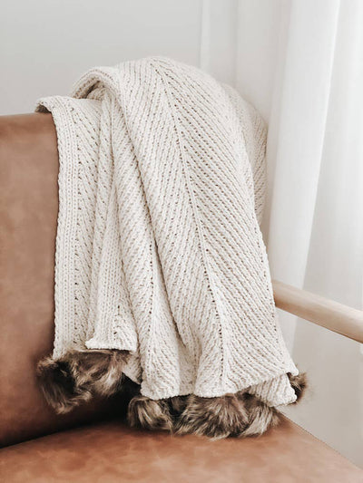 These blankets are cozy and soft making them the perfect accent for your sofa in the cooler seasons. We love the texture of this blanket and are certain you will too!   Medium-heavy weight 100% polyester Measures 4ft, 2in x 5ft, 2in The fabric is a natural fiber, therefore there may be some slight variations