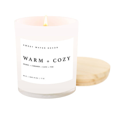 SCENT NOTES:  • Top: Orange Peel, Cinnamon, Ginger  • Middle: Clove, Cypress  • Base: Vetiver, Pine, Fir Balsam Warm + Cozy was voted "Best Fall Candle Overall" by Forbes Vetted (2022).     Perfect for Christmas, Holiday, Hostess Gift, Office Party, Winter, Fall, Halloween, Thanksgiving, + Housewarming.     CANDLE INFO:  • Jar Size: 11oz | 213g Net Weight | 3x3x3.5"  • Burn Time: 60+ Hours  • Wick: 100% Cotton (Lead and Zinc Free)  • Wax: Proprietary Soy Based Wax Blend | Vegan, Non-GMO, Kosher