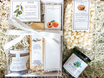 Snacks lovers will rejoice over these delicious snacks.  This set includes something that everyone can enjoy- a mini cracker, cheese bar, apricot jam cookies, mixed nuts, popcorn and delicious sevillano green olives.  An ideal gift for clients, employees, co-workers, or friends.  