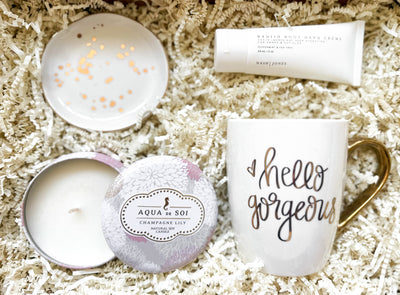 This beautiful “Hello Gorgeous” Gift Set is perfect for that special someone in your life. The set includes a white and gold speckled trinket dish, soy candle, mug, and radish root hand cream. The mug displays a bold and modern “Hello Gorgeous” message that will bring a smile to her face every time she uses it. 
