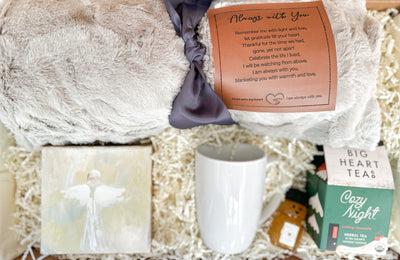 This comforting gift set has been lovingly created for those who are grieving. The ‘Always With You’ sympathy blanket will provide a physical reminder of comforting arms. Hand-painted angel art adds a touch of beauty to the atmosphere. The mug, cozy night herbal tea and mini honey will help create warmth and peacefulness.