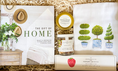 This curated set includes a gorgeous coffee table book, topiary tea towel, a travel sized candle and delicious snacks.  A great mix of delightful snacks + home goods, making it a wonderful gift for new home owners.  